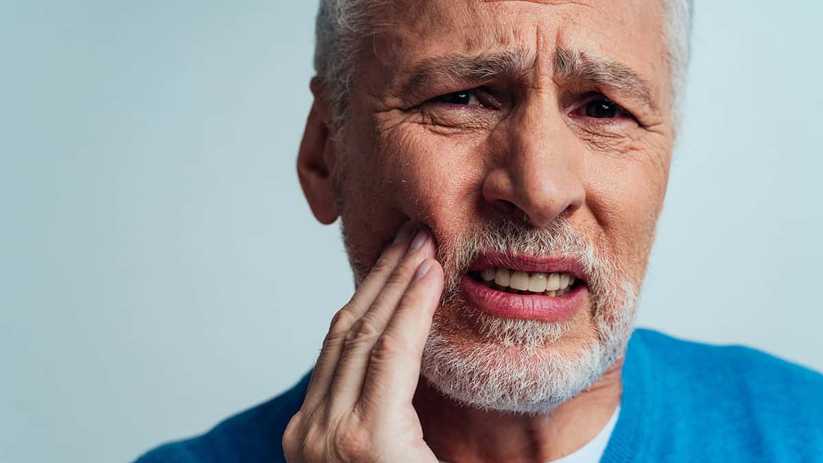 Person suffering from a tooth ache